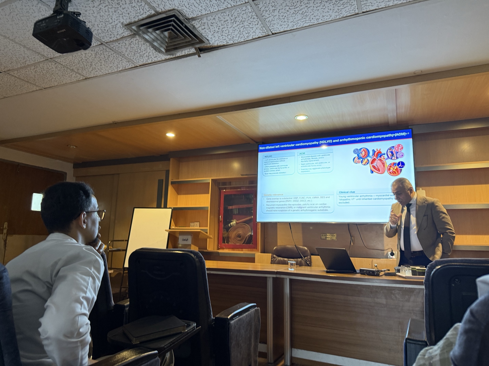 Dr. Mohammed Ghanem leading a cardiac genetics teaching session for Clinical Cardiology Board residents at Baghdad Teaching Hospital.